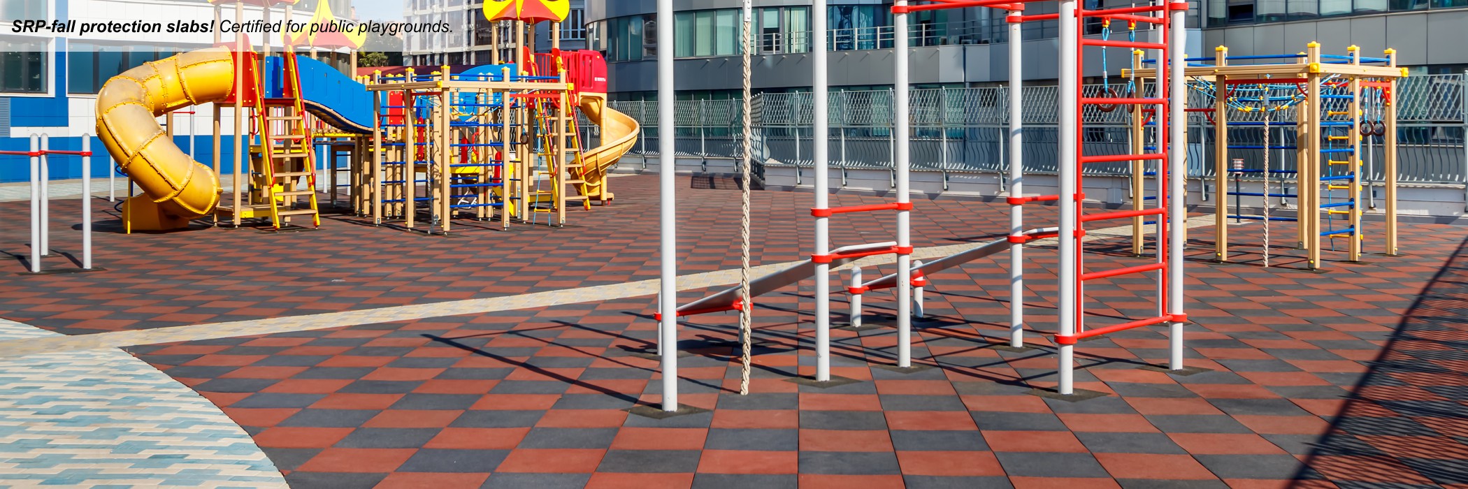 Children's playground with red plates, children's play equipment with black and yellow walls